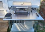 Gas grill with grilling tools inside available, mini fridge and coffee bar 